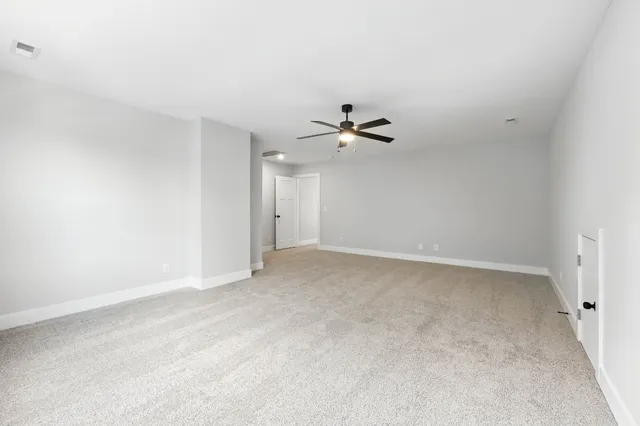 a view of a house with a ocean from a ceiling fan