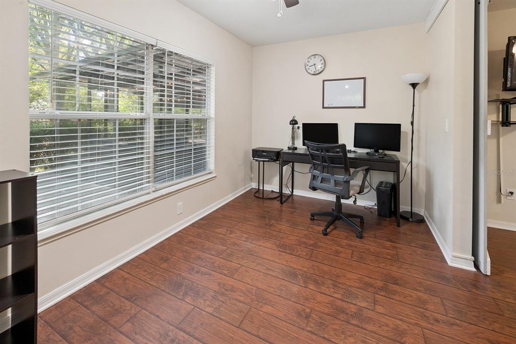 6924 Southwest 80th Drive Gainesville, FL 32608 - Photo 12 of 65 a living room with furniture and a wooden floor