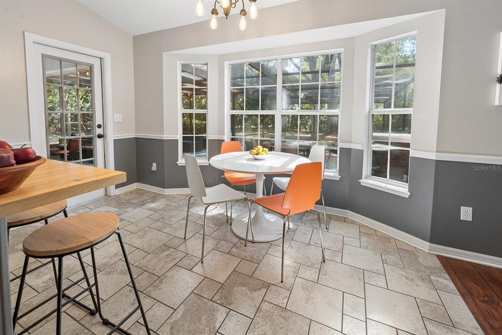 6924 Southwest 80th Drive Gainesville, FL 32608 - Photo 27 of 65 a outdoor seating space with furniture and a window