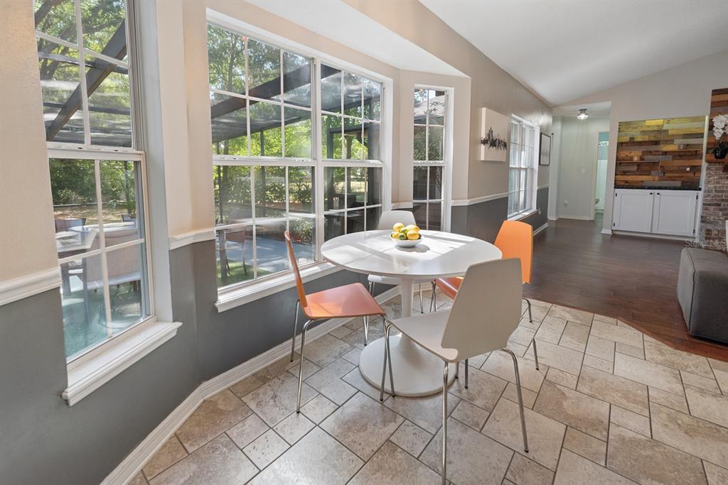 6924 Southwest 80th Drive Gainesville, FL 32608 - Photo 28 of 65 a dining room with furniture and window