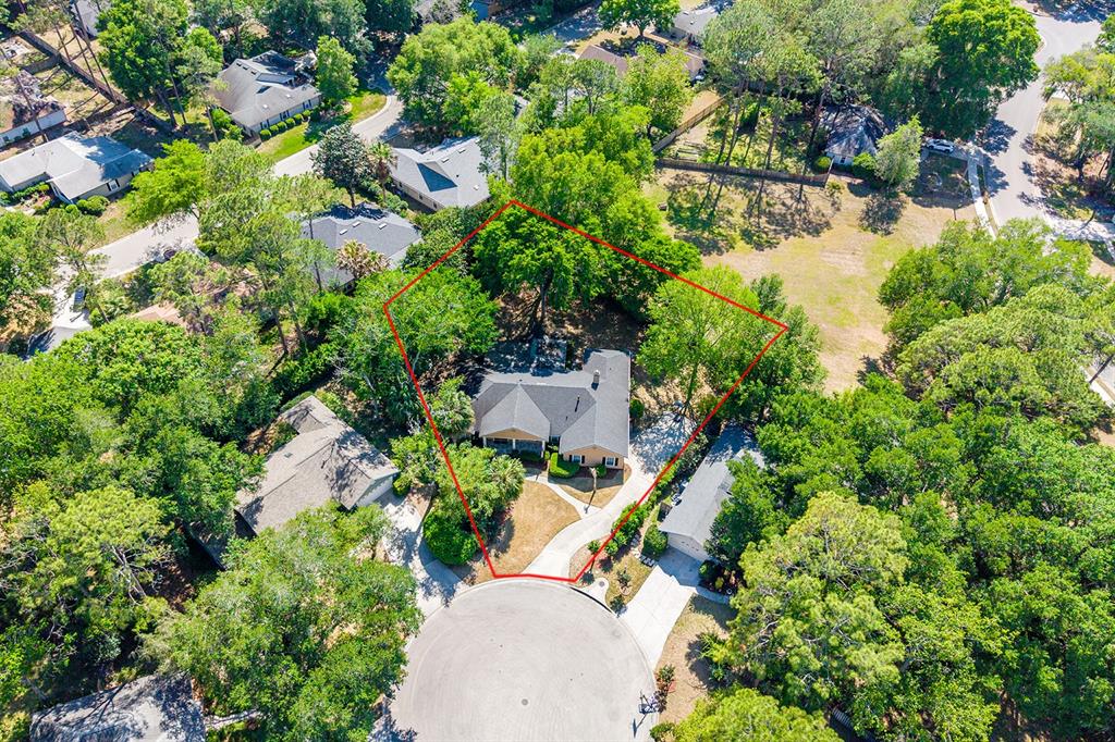6924 Southwest 80th Drive Gainesville, FL 32608 - Photo 55 of 65 an aerial view of a house with a yard and garden