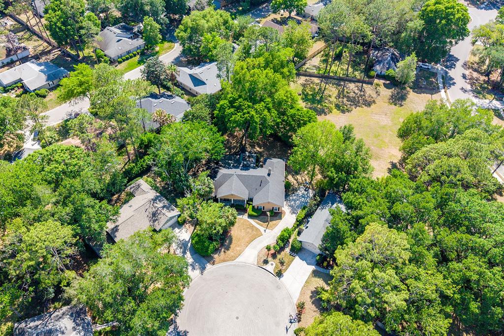 6924 Southwest 80th Drive Gainesville, FL 32608 - Photo 56 of 65 an aerial view of a house with a yard and garden