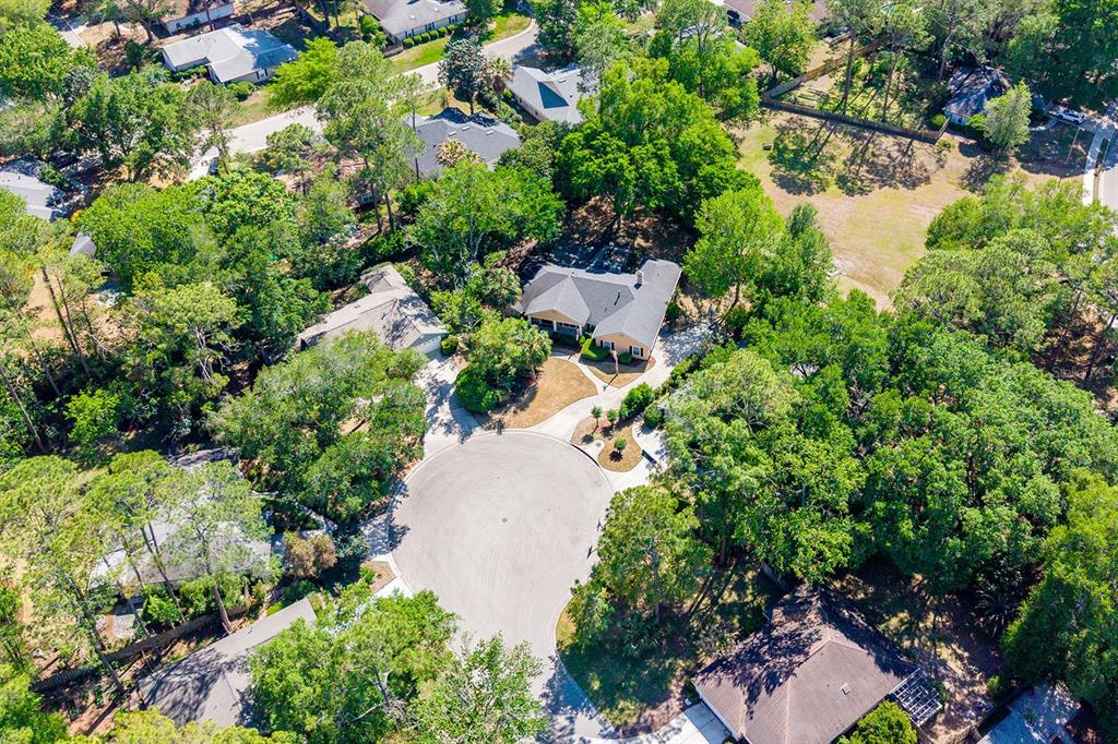 6924 Southwest 80th Drive Gainesville, FL 32608 - Photo 58 of 65 an aerial view of a house with a yard and lake view