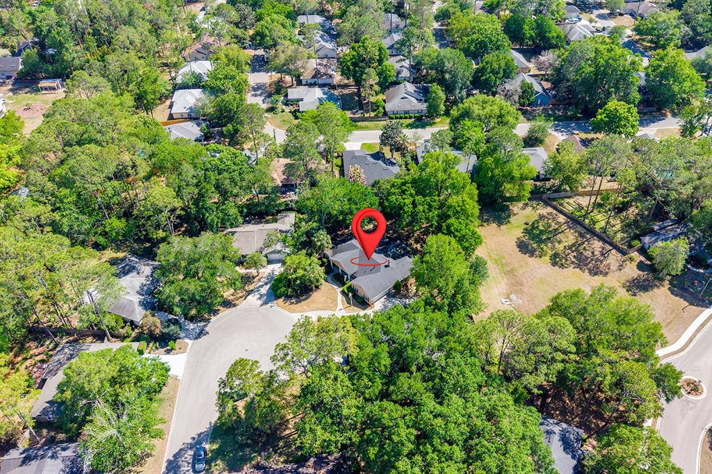 6924 Southwest 80th Drive Gainesville, FL 32608 - Photo 60 of 65 an aerial view of residential house with outdoor space and trees all around