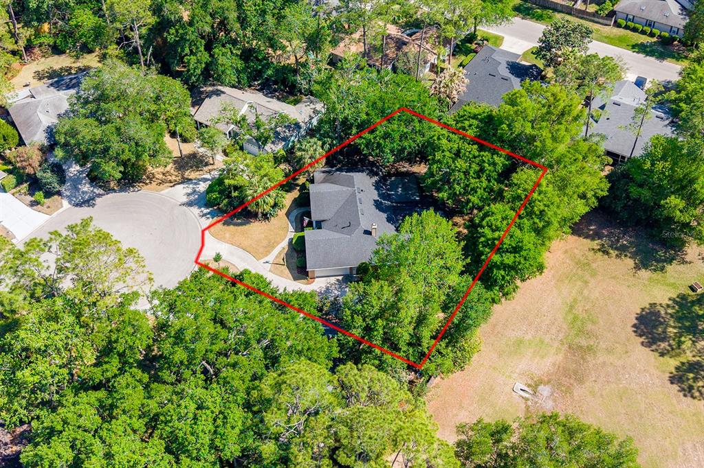 6924 Southwest 80th Drive Gainesville, FL 32608 - Photo 61 of 65 an aerial view of a house with a yard and lake view