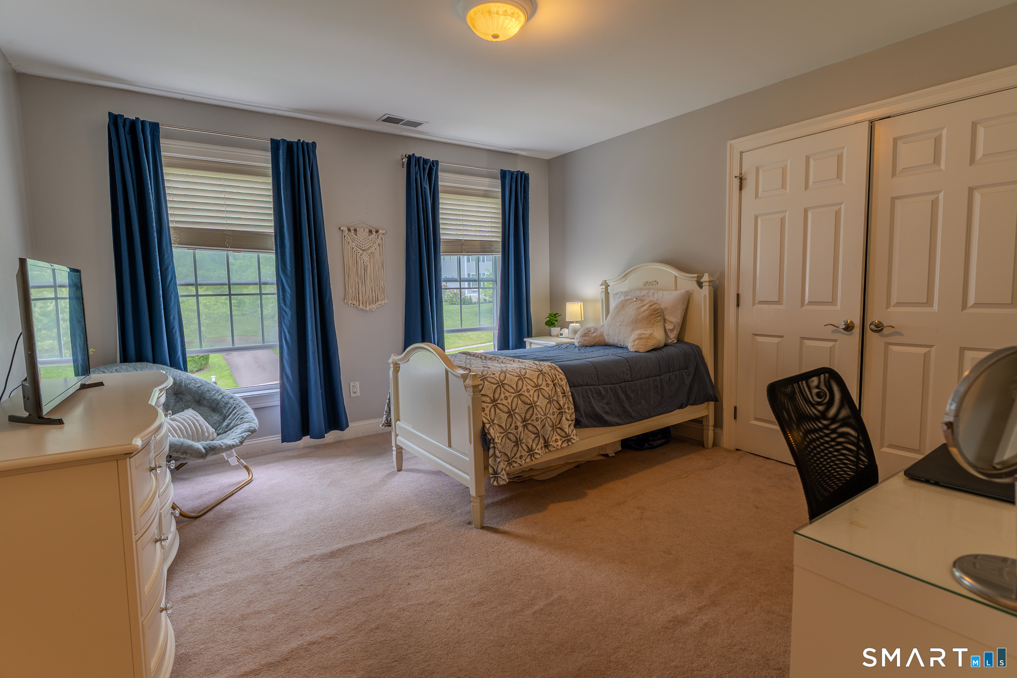 4 Ortense Road Wallingford, CT 06492 - Photo 23 of 33 a bedroom with a bed and large windows