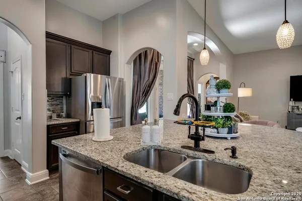 a kitchen with a sink a refrigerator and a sink