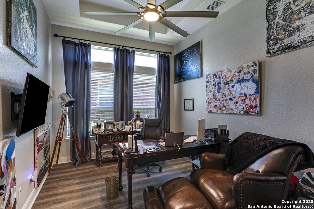 13326 Windmill Trace Helotes, TX 78023 - Photo 15 of 34 a living room with furniture and a flat screen tv