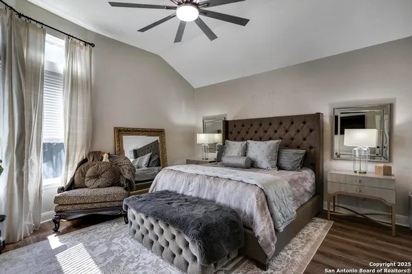 a bedroom with a bed and a couch
