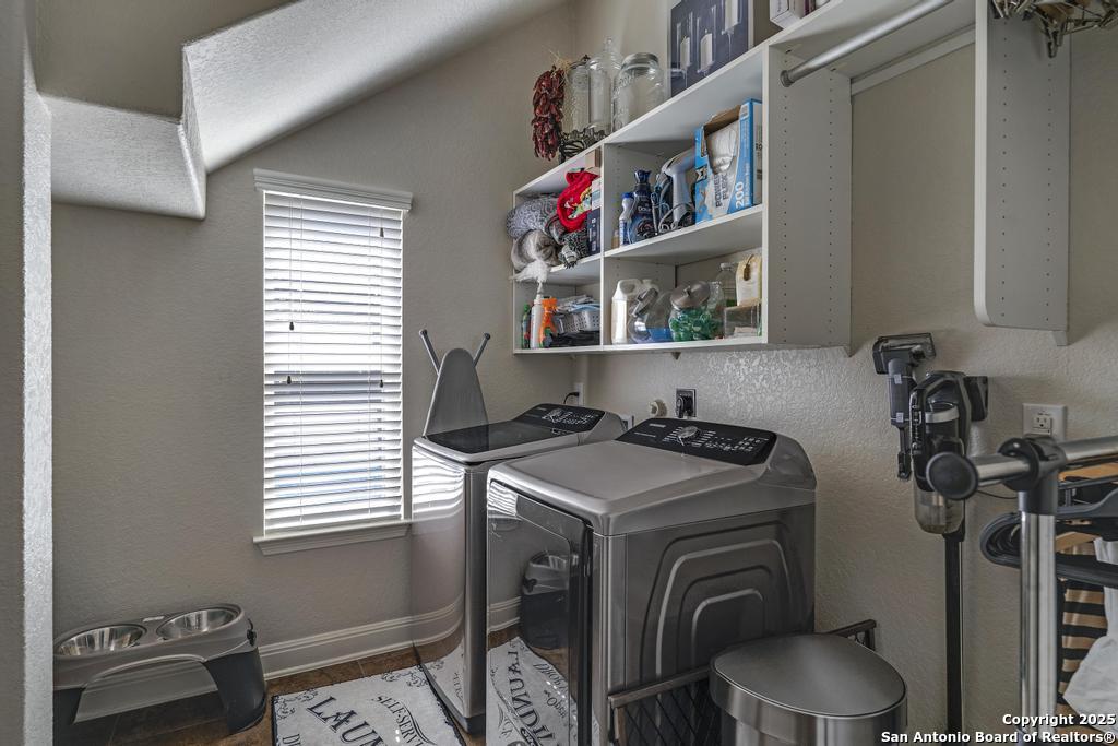 13326 Windmill Trace Helotes, TX 78023 - Photo 24 of 34 a utility room with dryer washer and a window