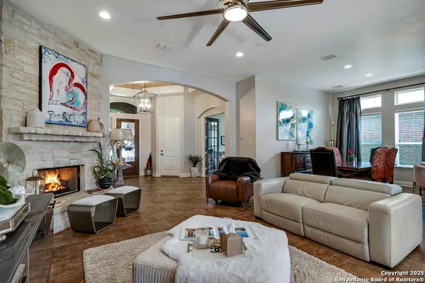 a living room with furniture and a fireplace