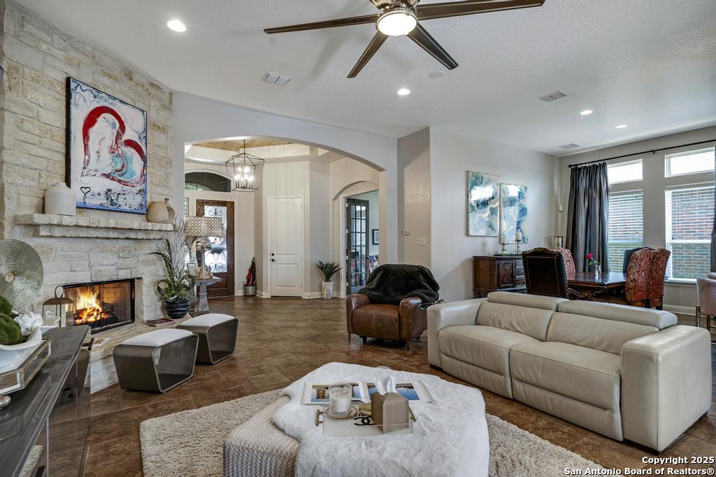 13326 Windmill Trace Helotes, TX 78023 - Photo 7 of 34 a living room with furniture and a fireplace