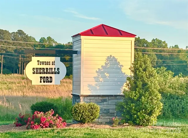 a sign board with a lake view
