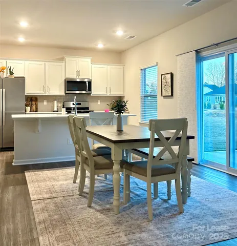 a view of a dining room with furniture