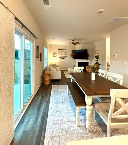 a dining room with a table and chairs