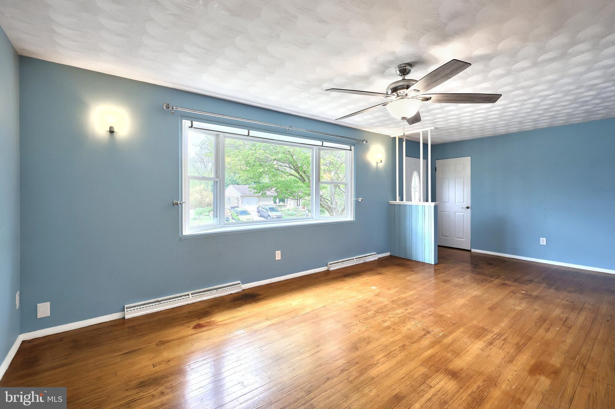 2550 Log Cabin Road York, PA 17408 - Photo 42 of 51 an empty room with windows and ceiling fan