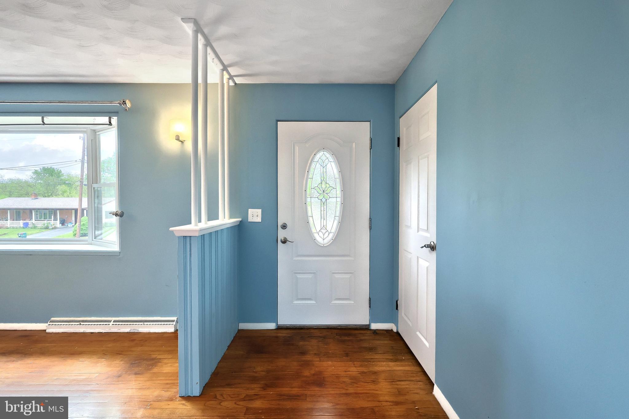2550 Log Cabin Road York, PA 17408 - Photo 6 of 51 a view of a hallway with wooden floor and front door