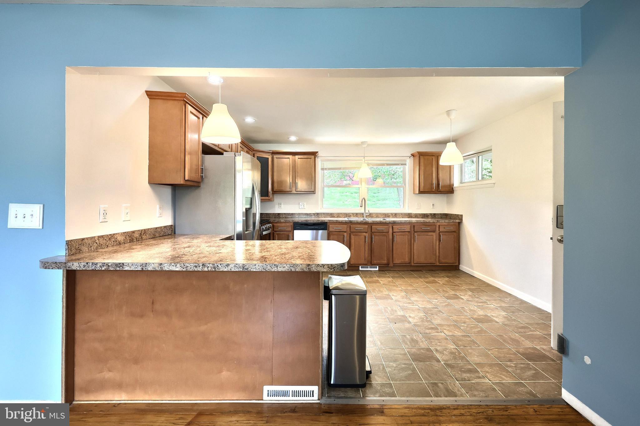 2550 Log Cabin Road York, PA 17408 - Photo 8 of 51 a kitchen with kitchen island granite countertop a sink and a stove