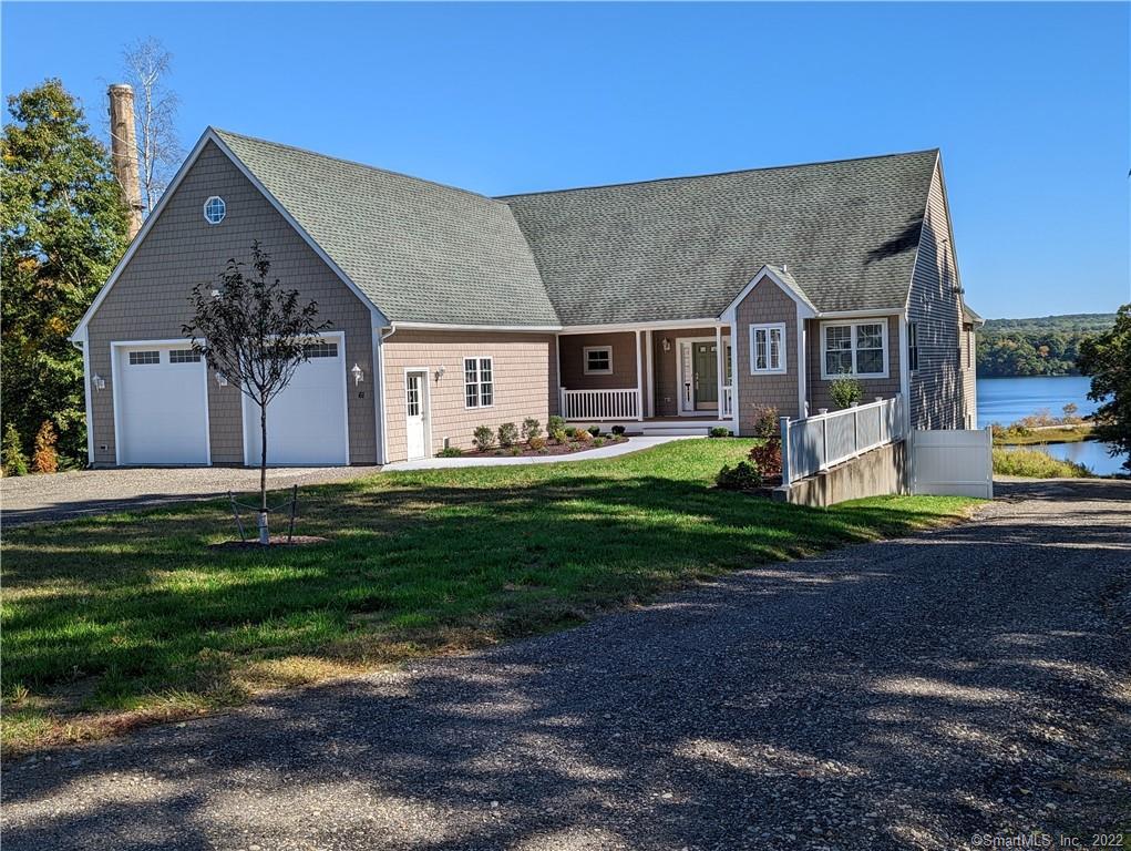61 Lathrop Road Waterford, CT 06375 - Photo 1 of 1 a front view of house with yard and green space