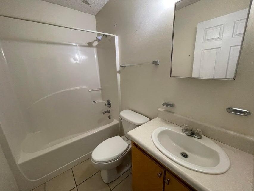 487 Woodlawn Road Freeport, FL 32439 - Photo 11 of 15 a bathroom with a sink toilet and shower