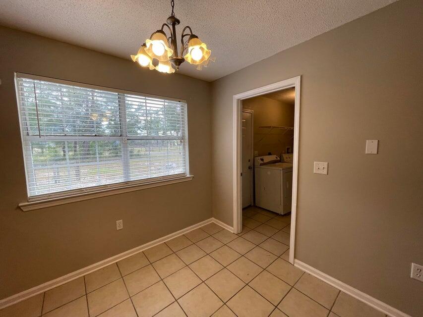 487 Woodlawn Road Freeport, FL 32439 - Photo 5 of 15 a view of an empty room with a window