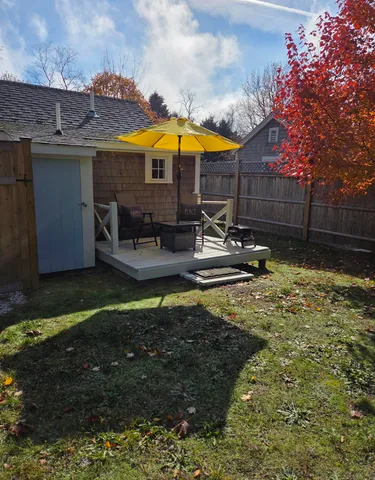 a swimming pool with outdoor seating yard and barbeque oven