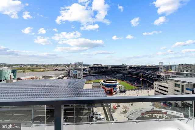 a view of a outdoor space with signage and flags