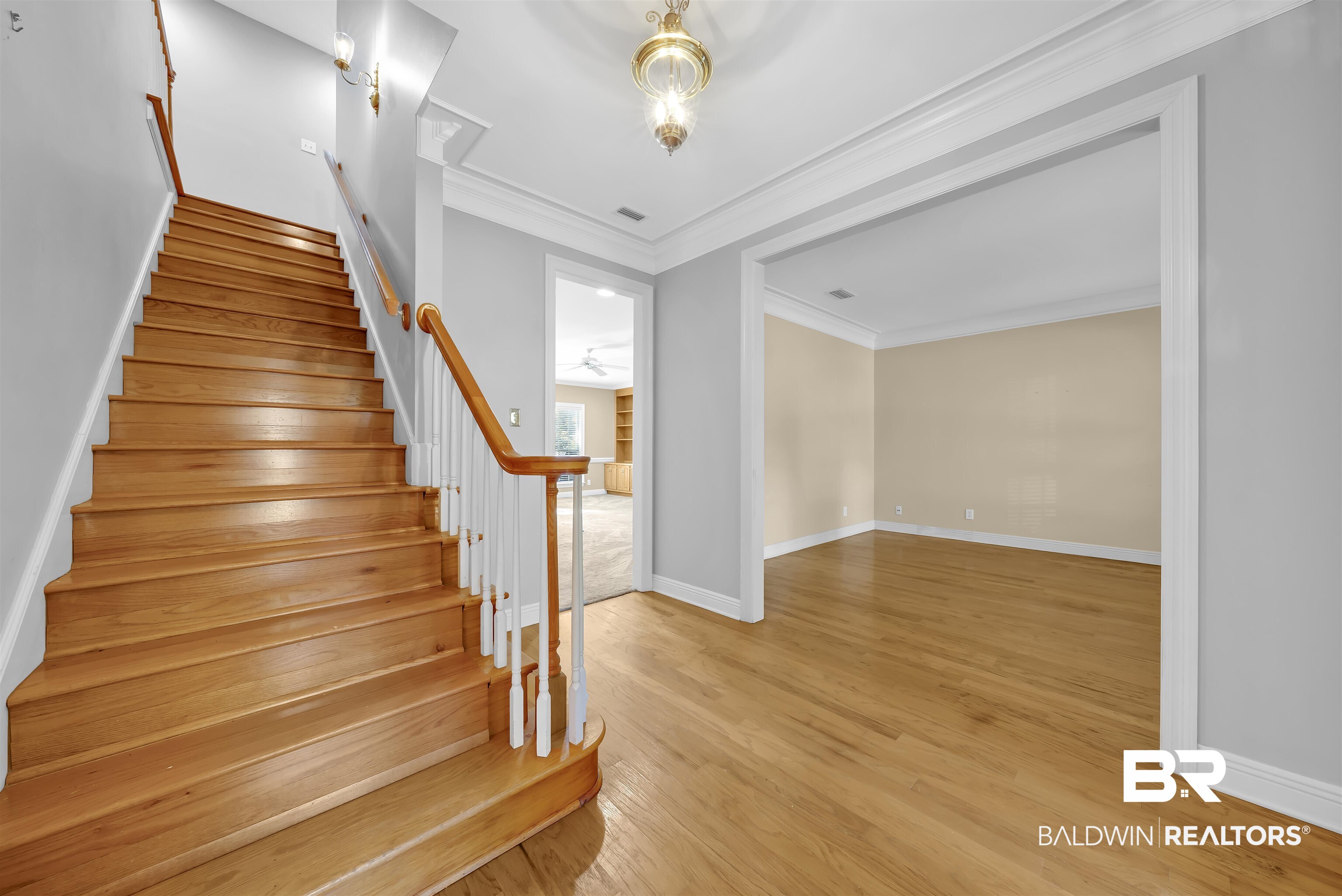 1262 Patrick Street Daphne, AL 36526 - Photo 4 of 35 Stairs featuring wood-type flooring and ornamental molding