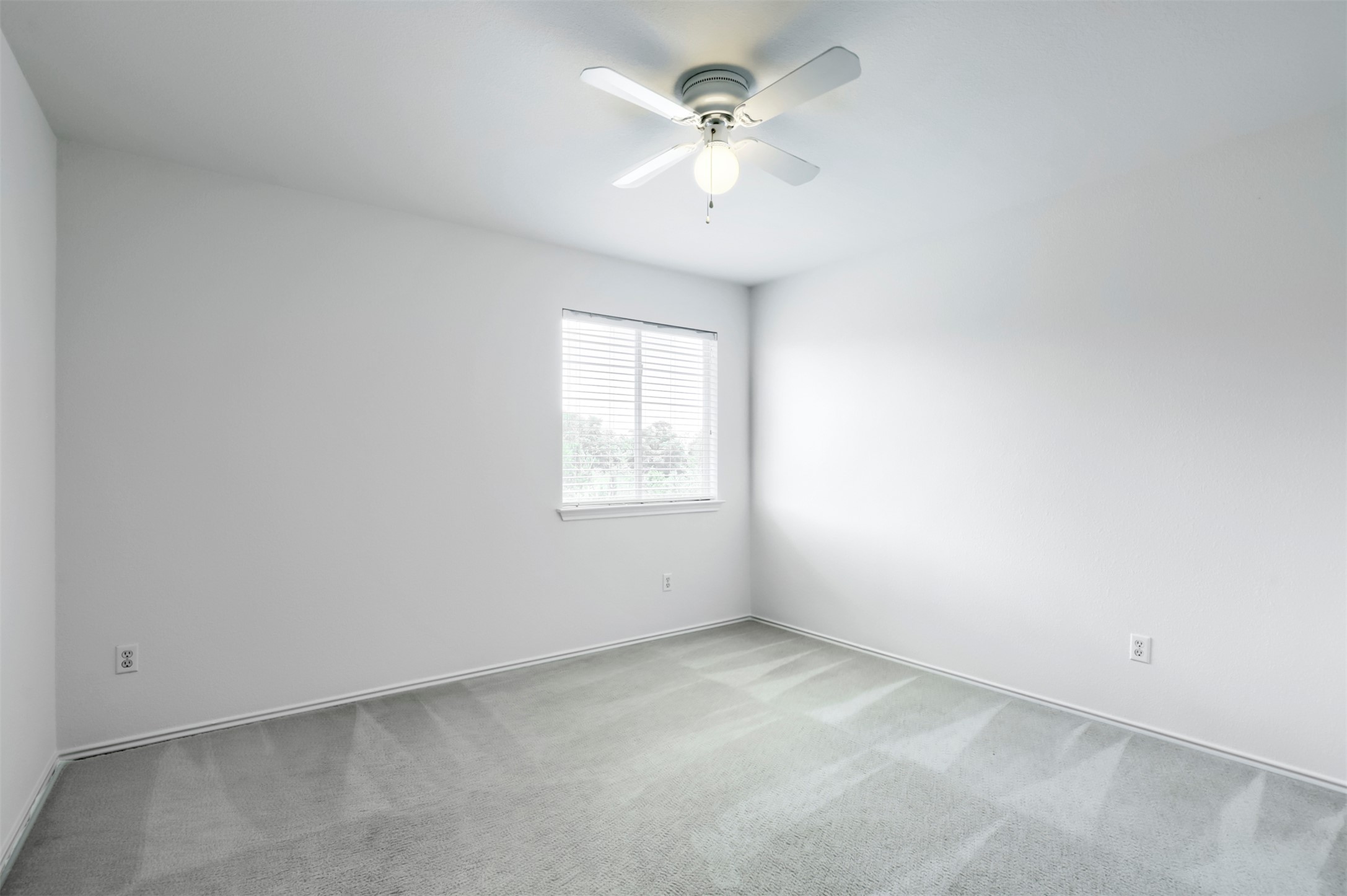 4125 Pebble Ridge Cove Round Rock, TX 78681 - Photo 25 of 30 An airy bedroom with soft carpeting and a window for natural illumination.