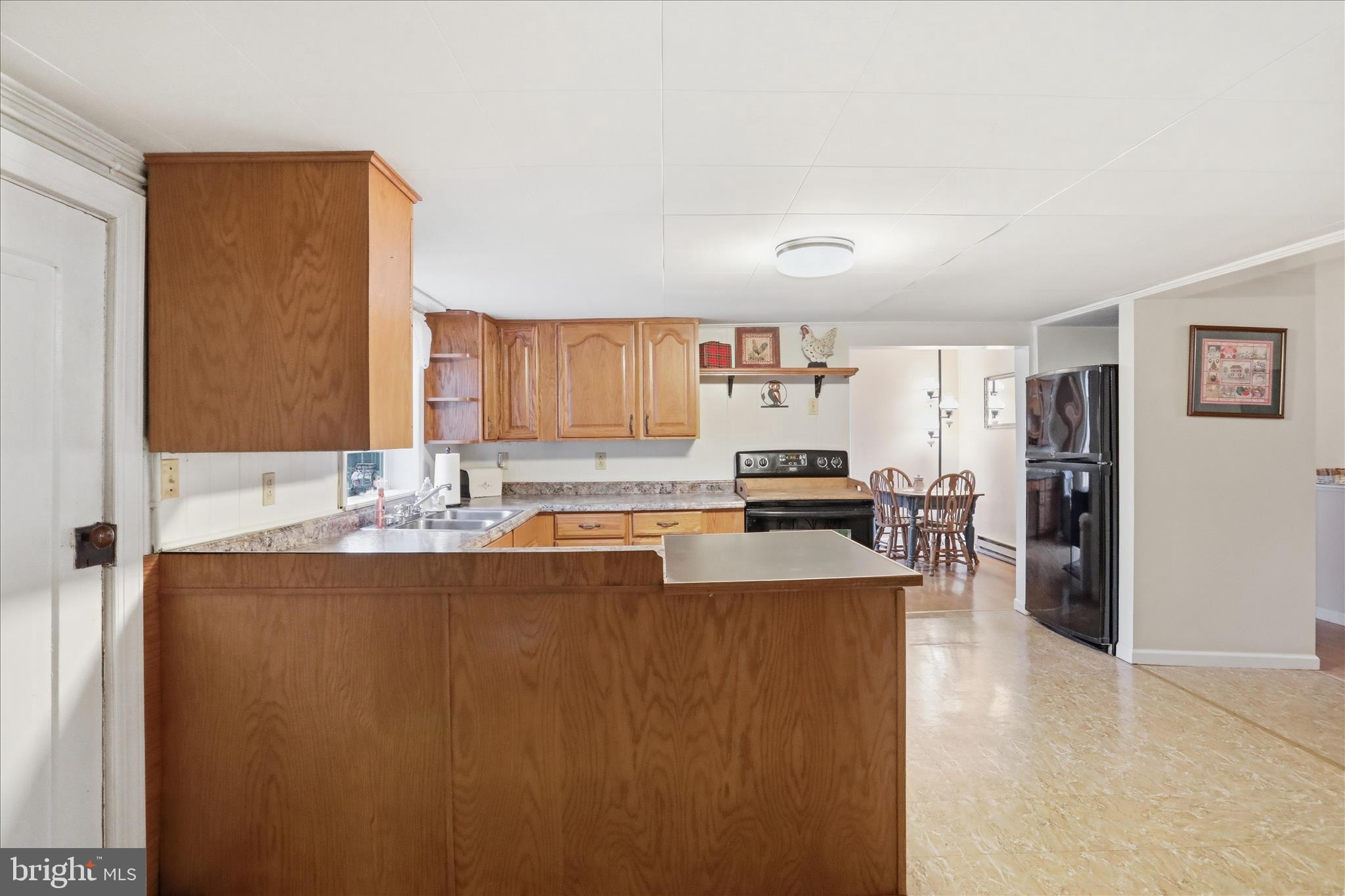 175 Clark Road Wardensville, WV 26851 - Photo 12 of 59 a living room with stainless steel appliances granite countertop furniture and a kitchen view