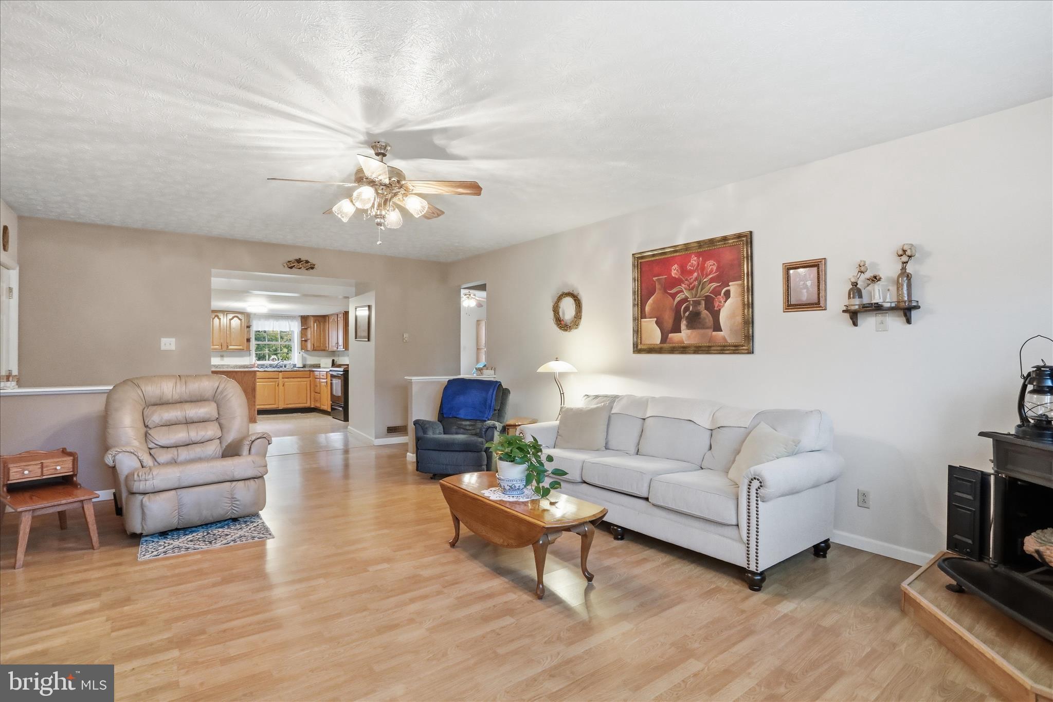175 Clark Road Wardensville, WV 26851 - Photo 16 of 59 a living room with furniture and a chandelier