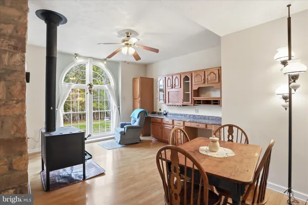 a view of a dining room with furniture and a chandelier