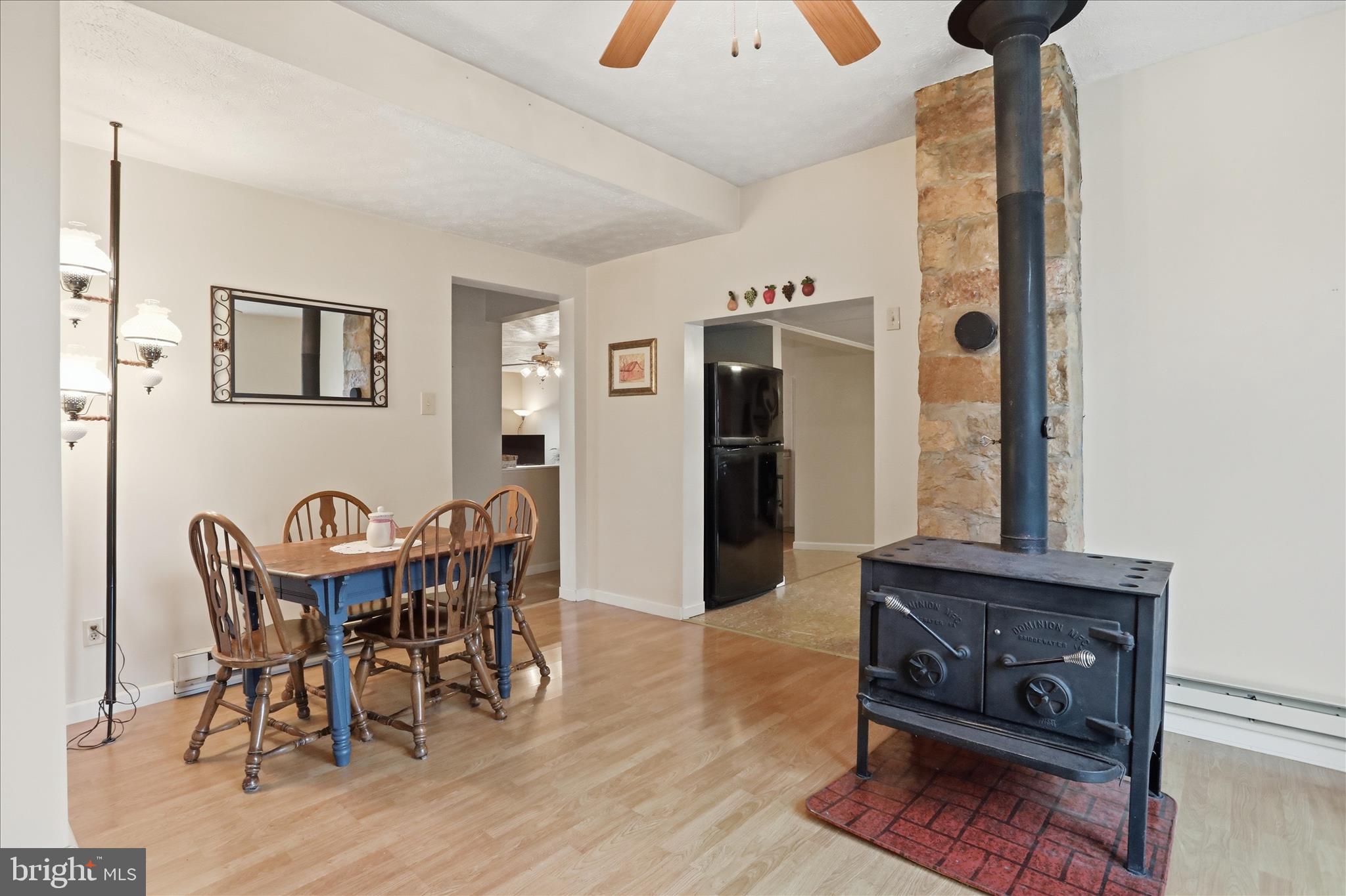 175 Clark Road Wardensville, WV 26851 - Photo 18 of 59 a view of a dining room with furniture and a chandelier