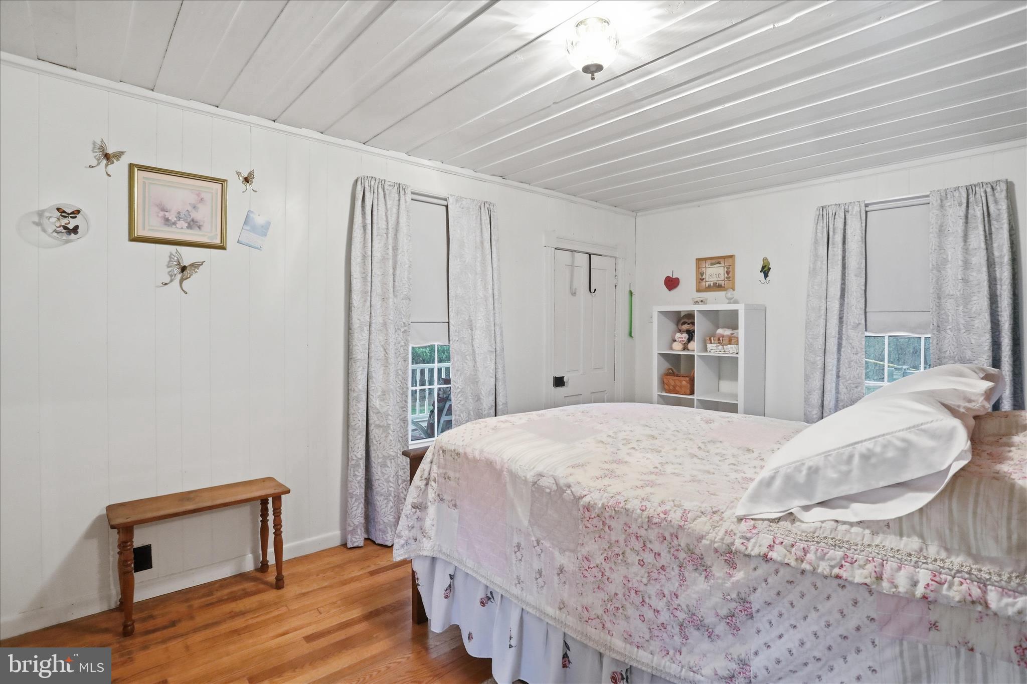 175 Clark Road Wardensville, WV 26851 - Photo 23 of 59 a bedroom with a bed and a window