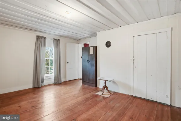 a view of entryway with wooden floor