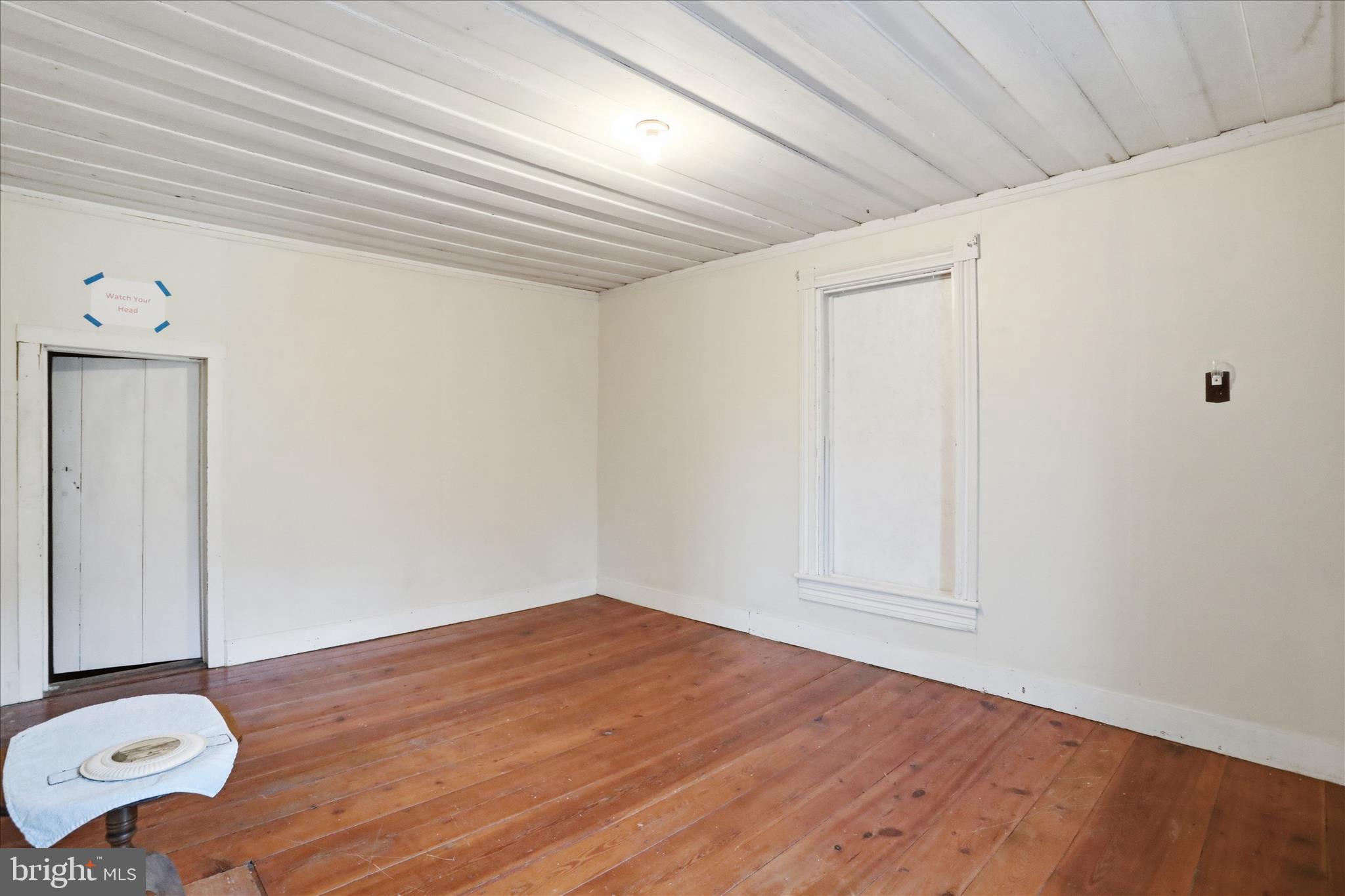 175 Clark Road Wardensville, WV 26851 - Photo 28 of 59 an empty room with wooden floor