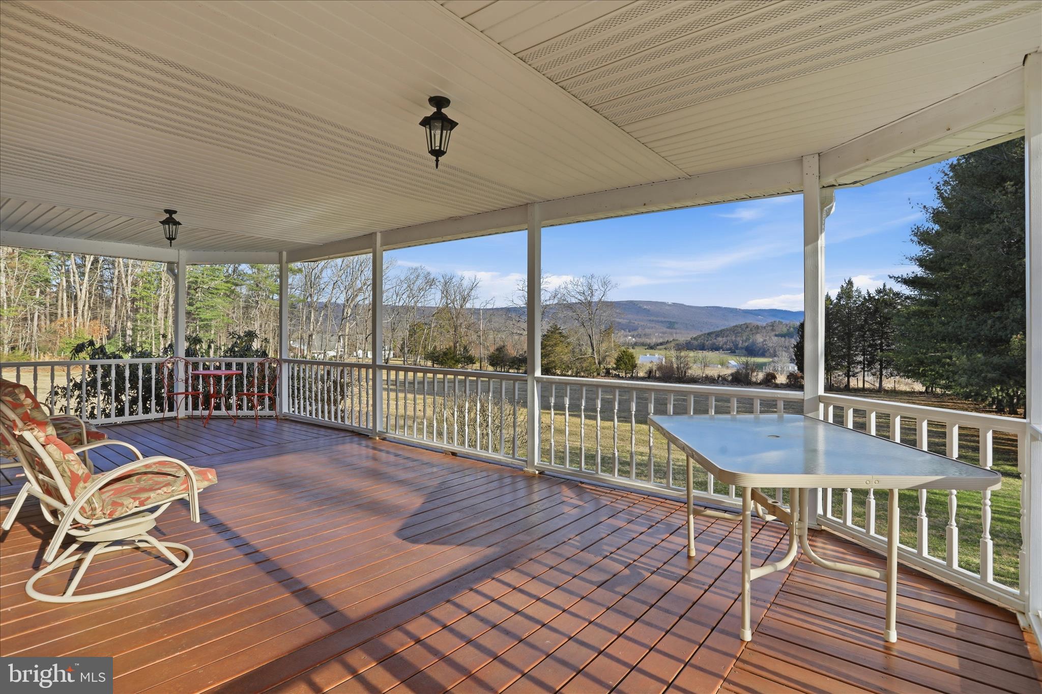 175 Clark Road Wardensville, WV 26851 - Photo 38 of 59 a balcony with furniture and wooden floor