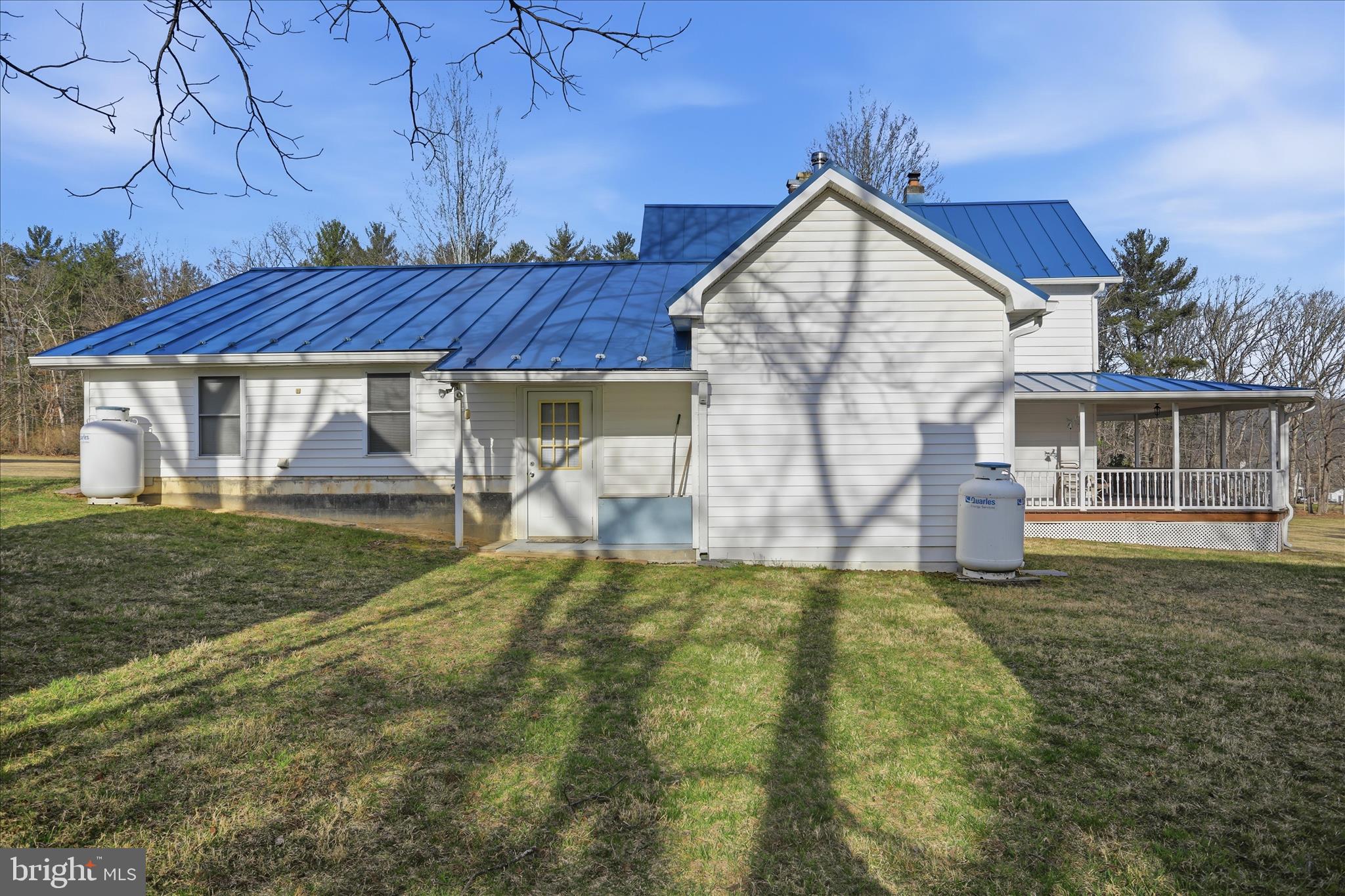 175 Clark Road Wardensville, WV 26851 - Photo 41 of 59 a view of a house with a yard