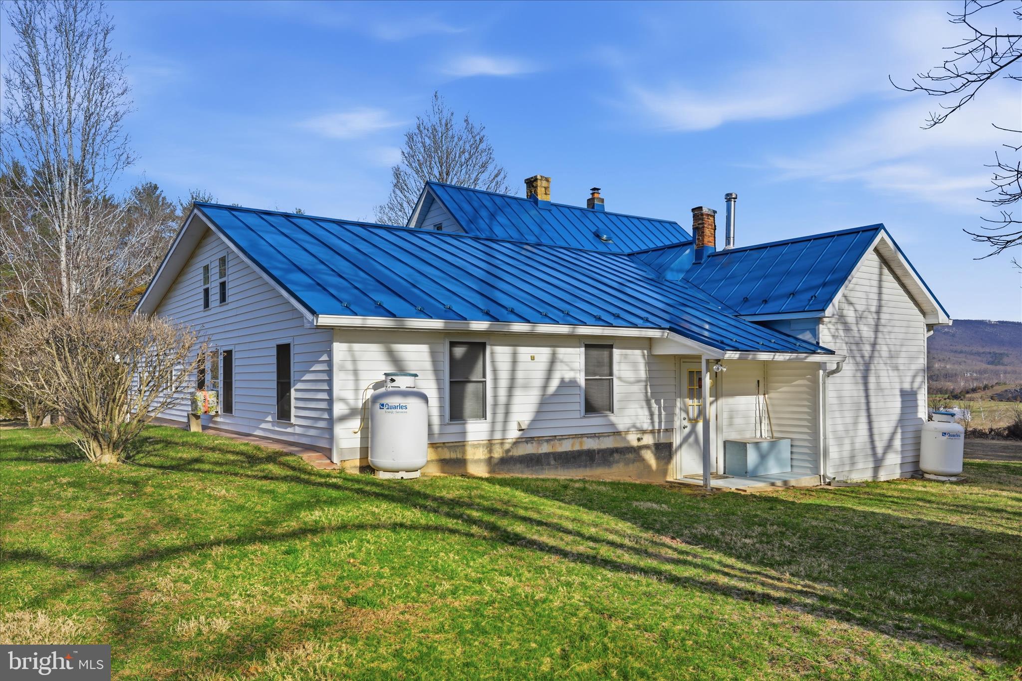 175 Clark Road Wardensville, WV 26851 - Photo 42 of 59 a view of a house with a yard