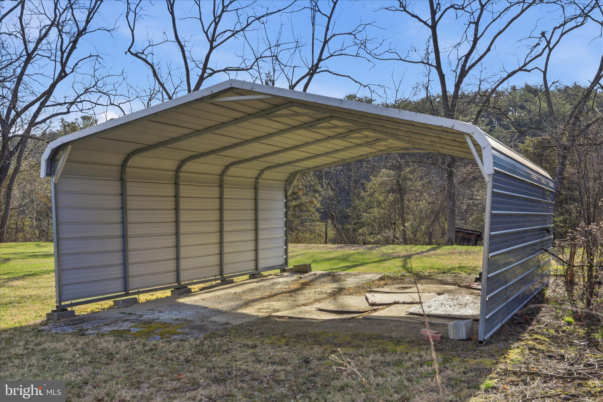 175 Clark Road Wardensville, WV 26851 - Photo 44 of 59 a yellow house sitting next to a yard