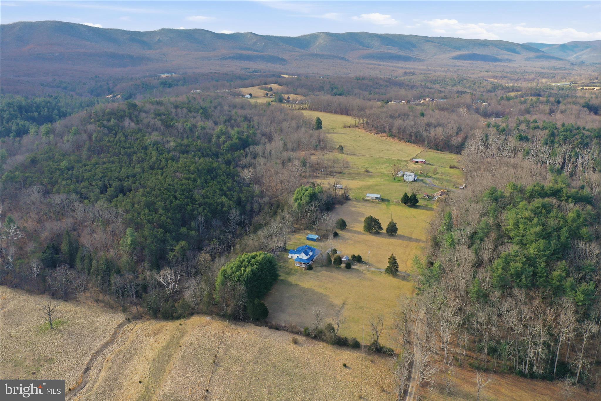 175 Clark Road Wardensville, WV 26851 - Photo 57 of 59 a view of a field with a mountain in the background