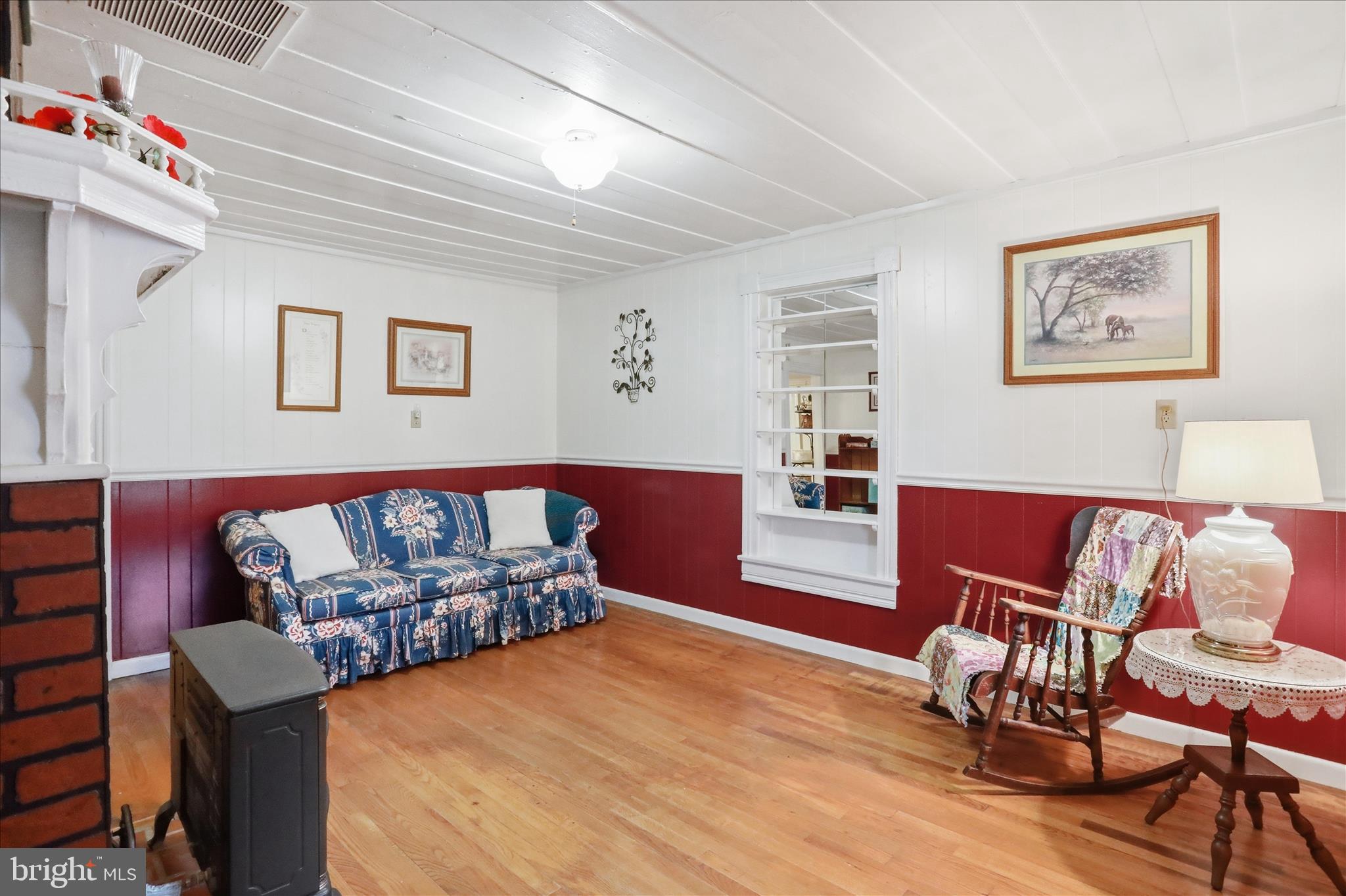 175 Clark Road Wardensville, WV 26851 - Photo 7 of 59 a bedroom with furniture and a wooden floor