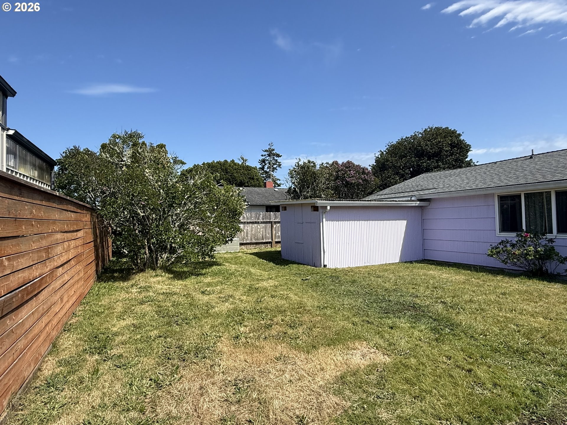 1179 6th Street Florence, OR 97439 - Photo 5 of 26 a view of a house with a yard