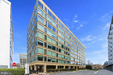 a view of a building with a yard