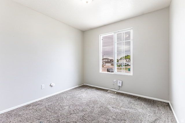 4239 West 5325th Street South Roy, UT 84067 - Photo 13 of 26 Light gray wall finishes and coordinating carpeting