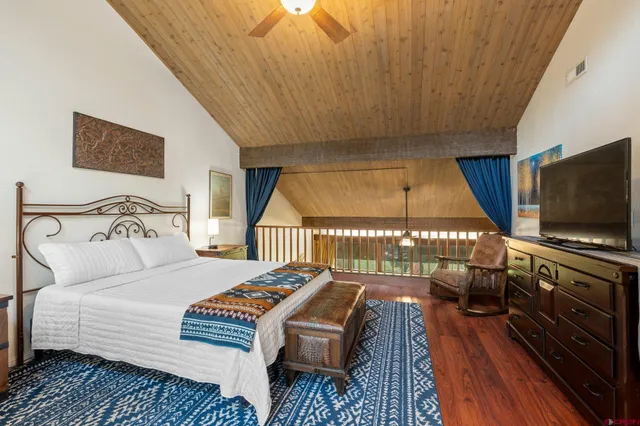 a balcony with table and chairs