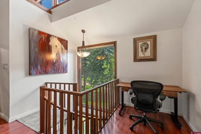 a view of washer and dryer with wooden floor