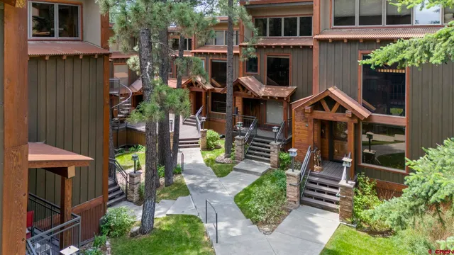 a view of a forest with a lake