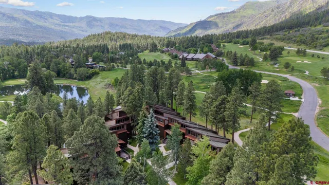 a view of a lake with a house in the background