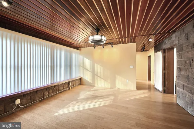 a kitchen with stainless steel appliances a sink a stove a refrigerator and cabinets